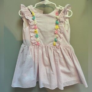 Pink seersucker dress with tassels. So feminine and adorable!